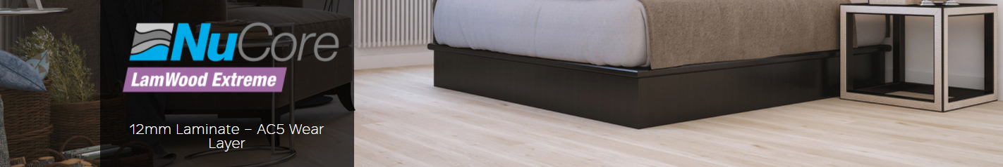 NuCore Extreme laminate flooring featuring a light wood design, showcasing a bedroom setting with a bed and nightstand, highlighting the 12mm thickness and AC5 wear layer.